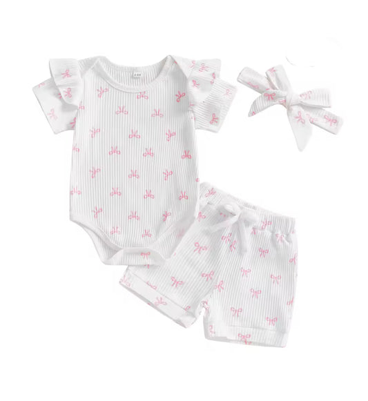 Baby outfit set with romper, shorts, and headband featuring pink floral patterns on a white background.