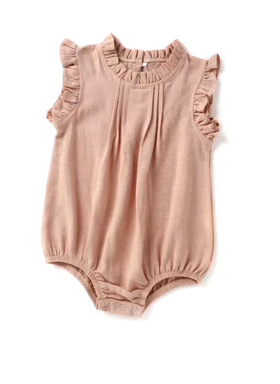 Pink baby romper with ruffled details on a white background