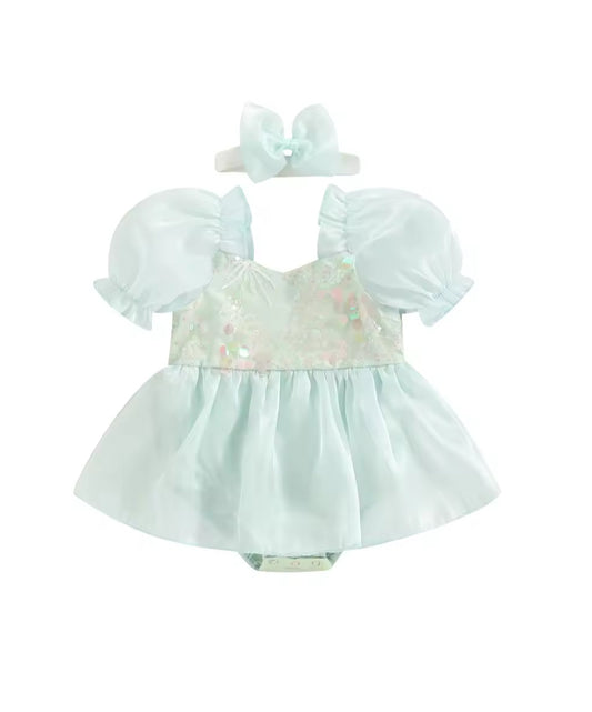 Light blue baby dress with floral details and matching headband on a white background
