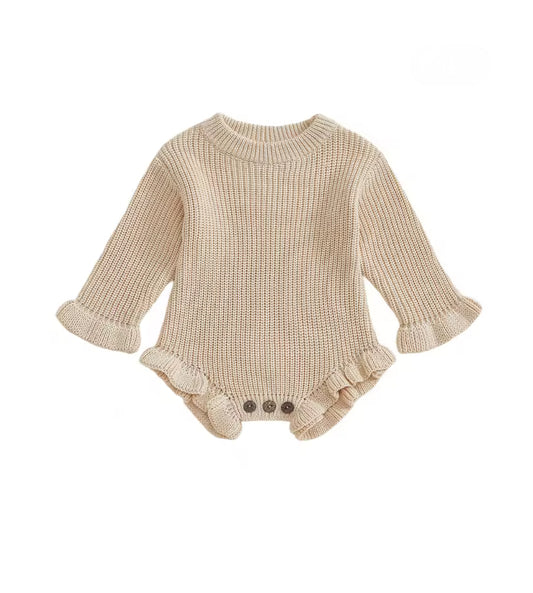 Beige knitted baby romper with ruffled details on a white background