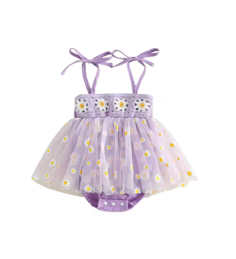 A baby girl's lavender tulle tutu dress with daisy print, featuring a lace bodice with embroidered flowers and adjustable ribbon shoulder straps.