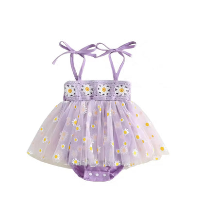 A baby girl's lavender tulle tutu dress with daisy print, featuring a lace bodice with embroidered flowers and adjustable ribbon shoulder straps.