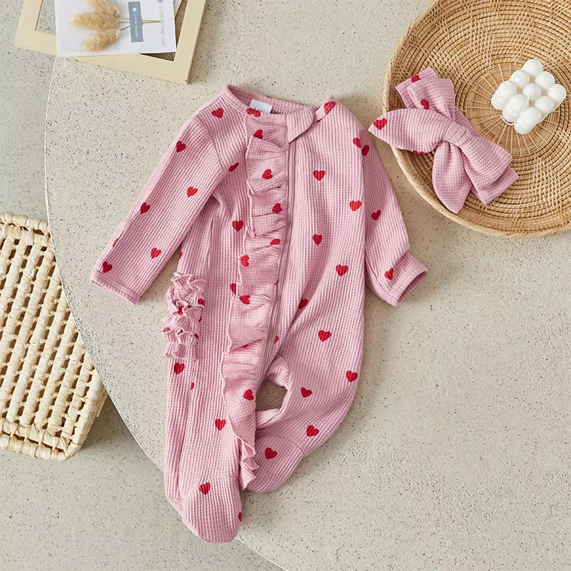 Newborn baby girls romper with heart print and matching headband 
