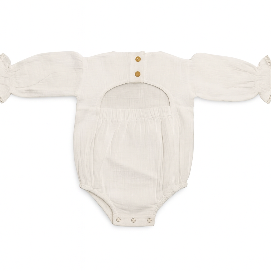 White baby romper with long sleeves on a white background
