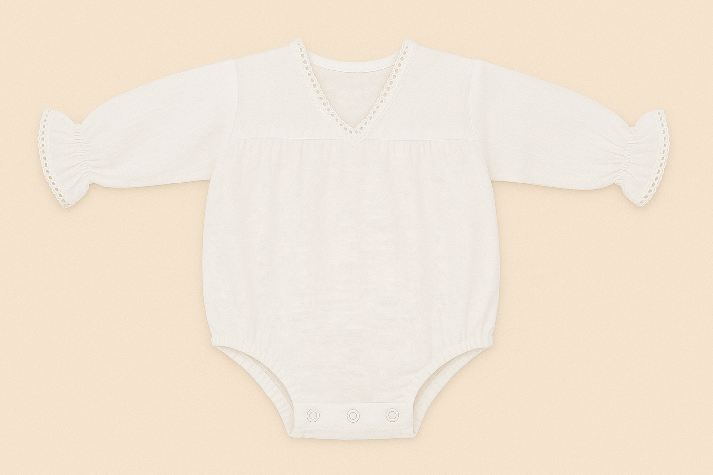 White baby onesie with ruffled sleeves on a beige background