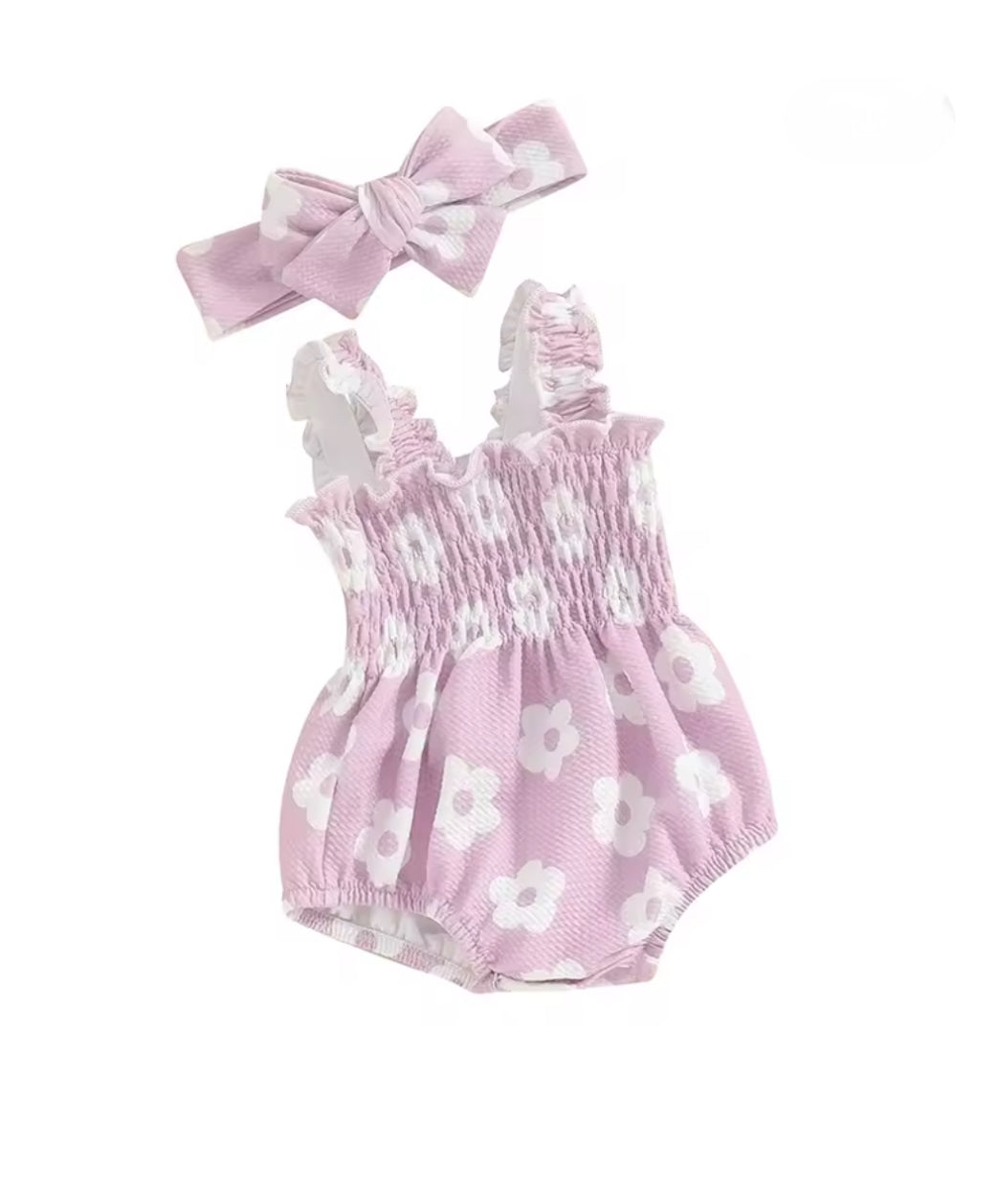 Baby romper with floral pattern and matching headband on a white background