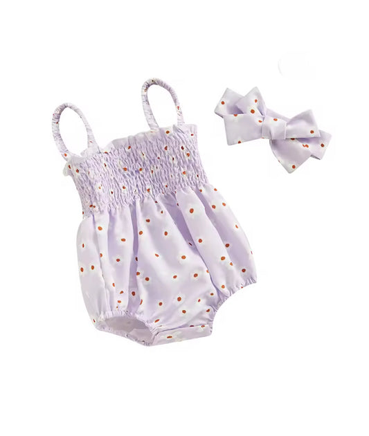 Baby romper with daisy pattern and matching headband on a white background
