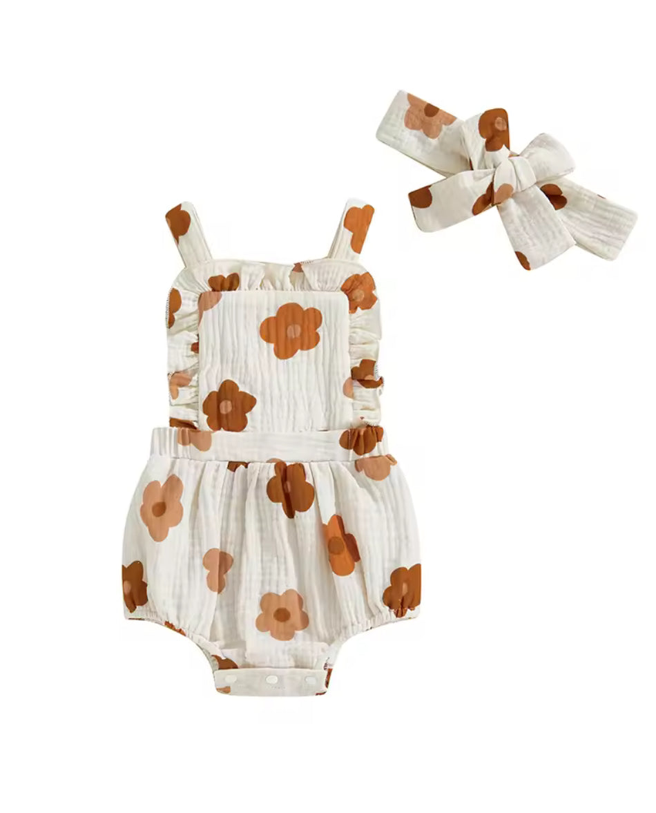 Baby romper with brown floral pattern and matching headband on a white background
