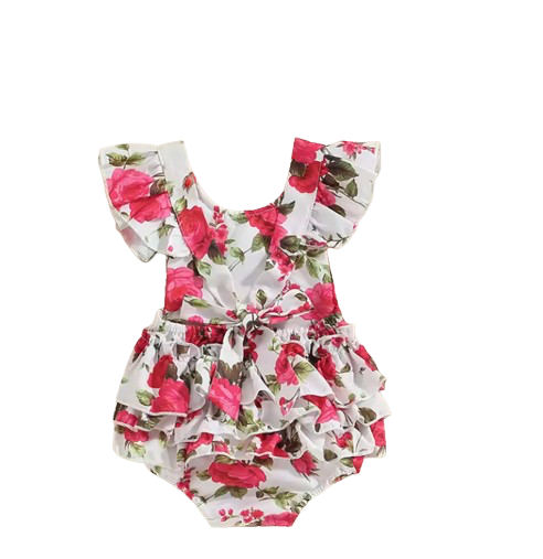 Floral baby romper with ruffles on a white background